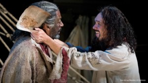 Edmond Dantes (Al Espinosa) embraces fellow prisoner Faria (Derrick Lee Weeden) upon receiving Faria’s treasure map in Act 1 of OSF’s The Count of Monte Cristo. Photo by Jenny Graham.