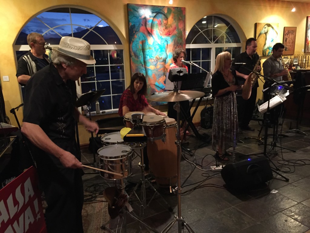 ¡Salsa Brava! (l-r Bassist Jeff Addicott, percussionists Mike Fitch and Theresa McCoy, Keyboardist Anne Muth, Vocalist & flutist Christina Marsilia, Tenor Saxophonist Gordon Greenley and Soprano Saxophonist Daniel Chavez) performing at their "Last Dance of the Season" at Paschal Winery in Talent, OR on October 10, 2015