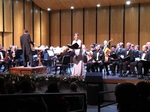 Soprano Lindsay Ohse singing beautifully, smiling beautifully, and looking beautiful in a lovely gown while performing "There were shepherds abiding in the field" during performance of Handel's "Messiah" at Grants Pass Performing Arts Center in Grants Pass, OR on December 3, 2015.